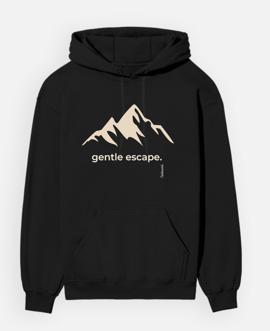 Black hoodie with mountain graphic and 'gentle escape' text on a white background